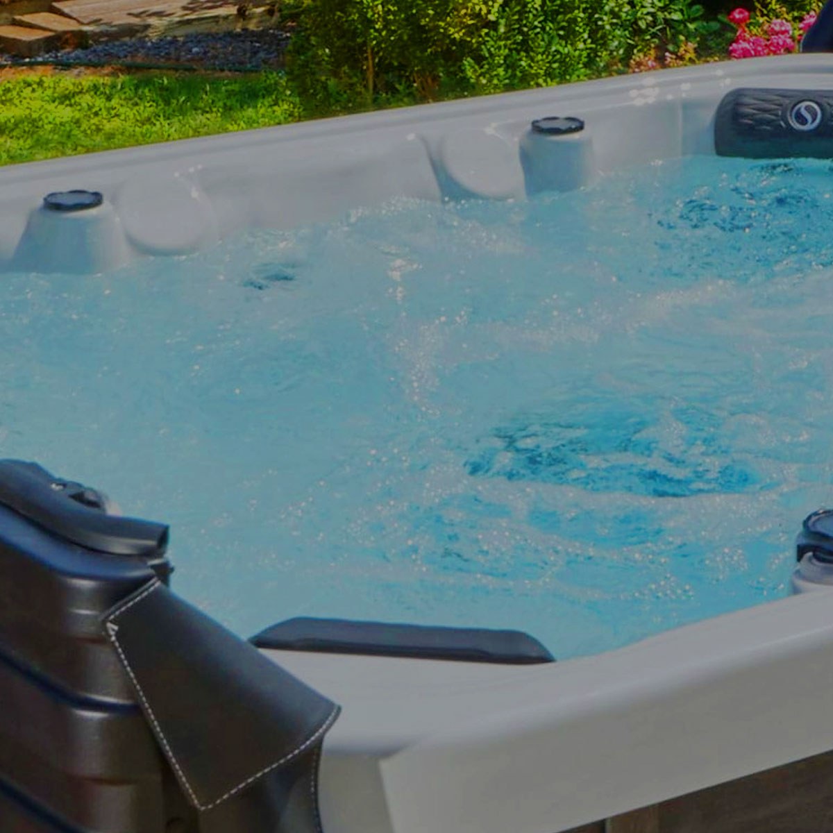 Bubbling water and contoured seating in an outdoor Strong Spa